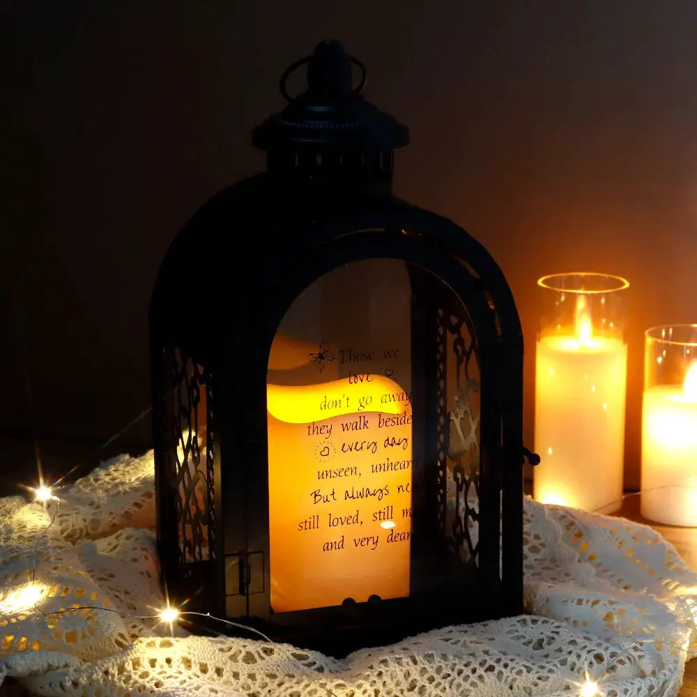 11-inch black memorial lantern with automatic timer and amber glow.