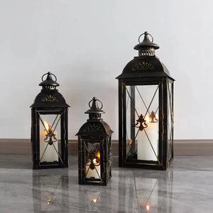 Set of 3 black decorative hanging candle lanterns (19in, 13.5in, 9.5in) by JHY DESIGN with glass panels.