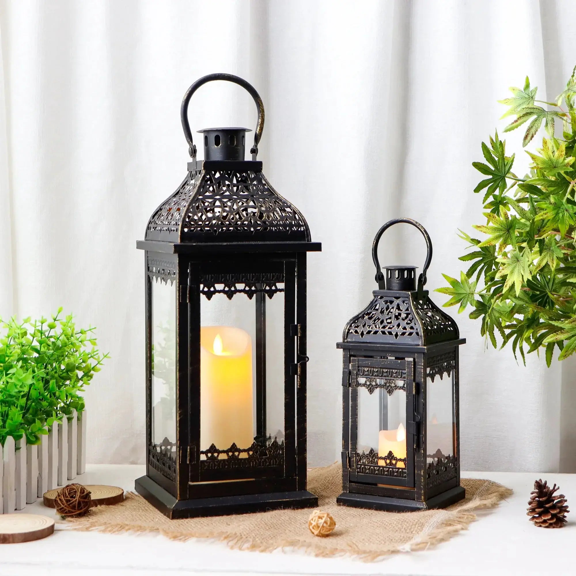 Decorative candle lanterns set of 2; black metal with brushed gold finish, 13in and 19.5in tall