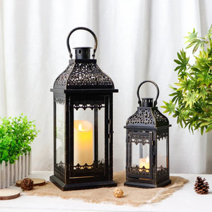 Decorative candle lanterns set of 2; black metal with brushed gold finish, 13in and 19.5in tall