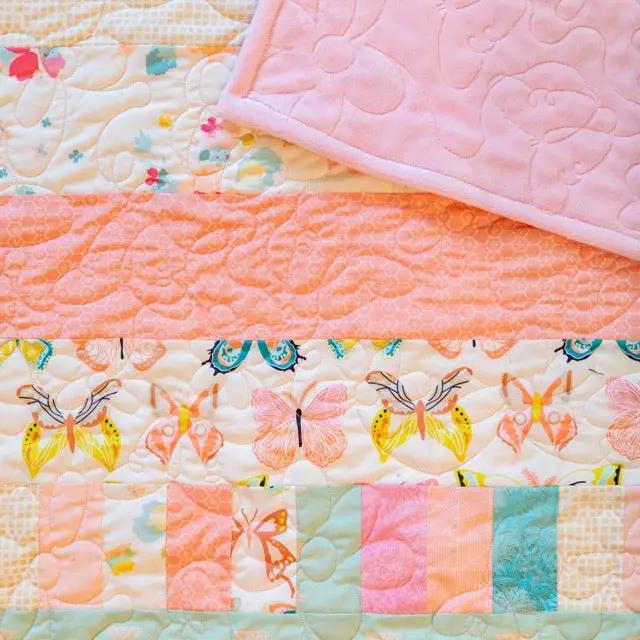 Quilt kit Bricks and Beams - Butterflies by Block Party Quilt Co; pastel butterfly fabrics and brick-block patchwork.