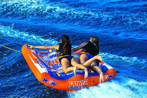 Towable WOW Power Steer 2-Person deck tube in orange/blue with two riders.