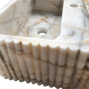 Calacatta Gold marble wall-mount bathroom vanity sink by Villohome, fluted exterior.