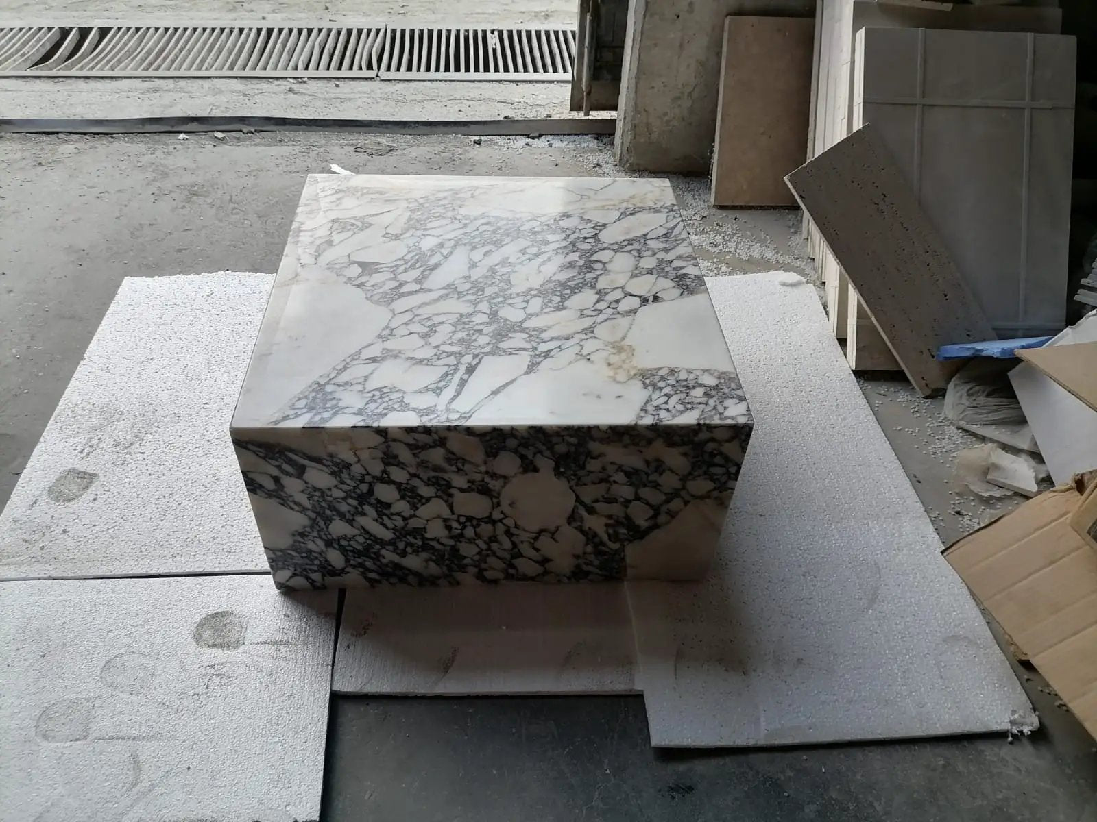 Calacatta Viola marble coffee table, rectangular block with white surface and gray veining, 24x24x12 in