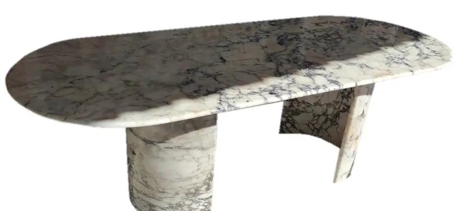 Calacatta Viola marble oval dining table by Villohome with polished finish and C-shaped legs