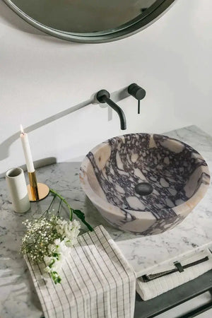 Calacatta Viola marble vanity sink by Villohome; round tapered vessel with white veining, honed matte finish.
