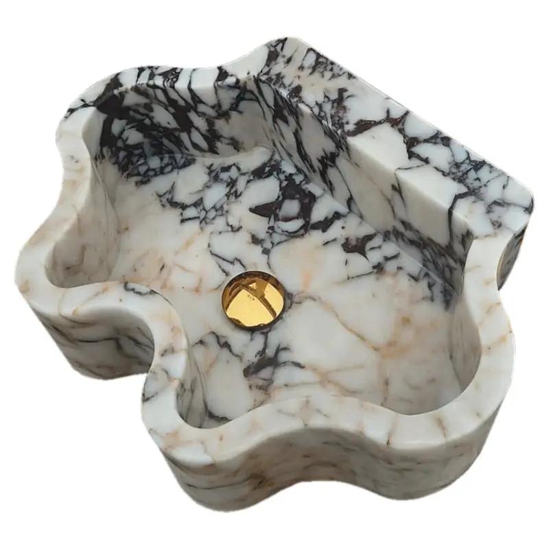 Calacatta Viola marble wall-mount bathroom sink with wavy edges, white with gray/brown veining