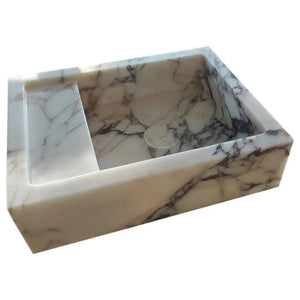 Calacatta Viola marble wall-mount bathroom sink, rectangular white stone with gray veining.