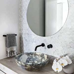 Villohome Calacatta Viola polished marble round above-vanity bathroom sink vessel with black faucet.