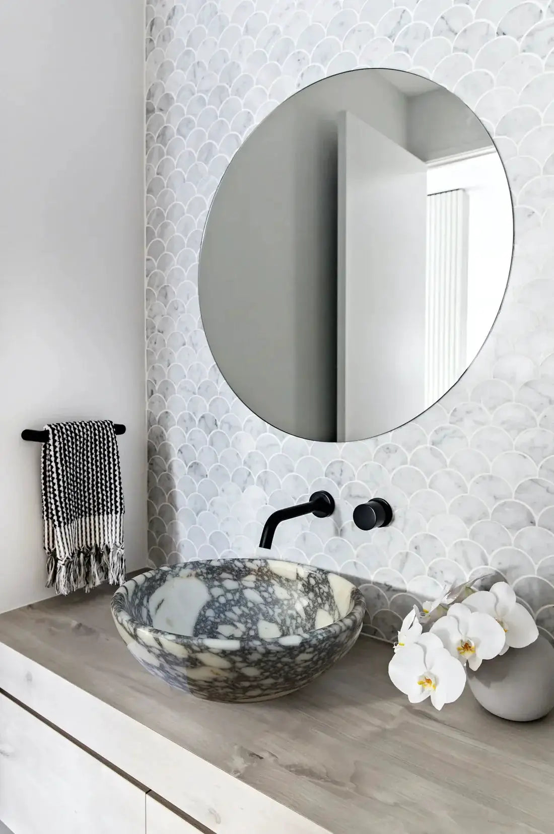 Calacatta Viola Marble above-vanity bathroom sink by Villohome, round marble vessel with gray veining.