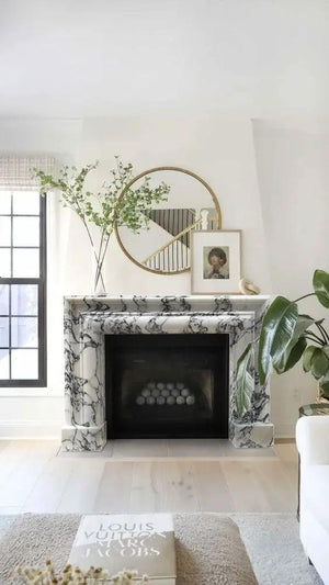 Calacatta Viola marble hand-carved fireplace mantel, polished white with dark veining.