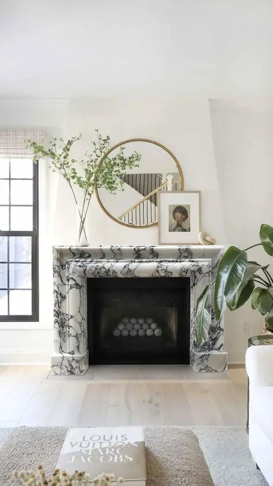 Calacatta Viola marble hand-carved fireplace mantel, polished white with dark veining.
