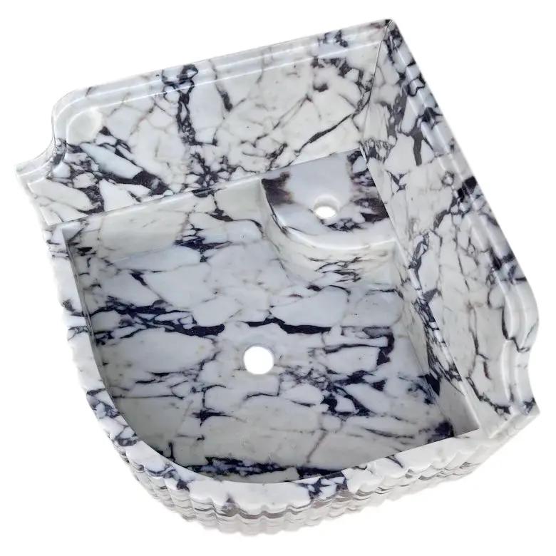 Villohome Calacatta Viola marble wall-mount corner sink, fluted with 8" backsplash.