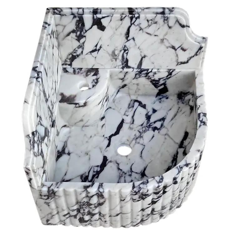 Calacatta Viola marble wall-mount corner sink by Villohome, fluted sides with 8-inch backsplash.