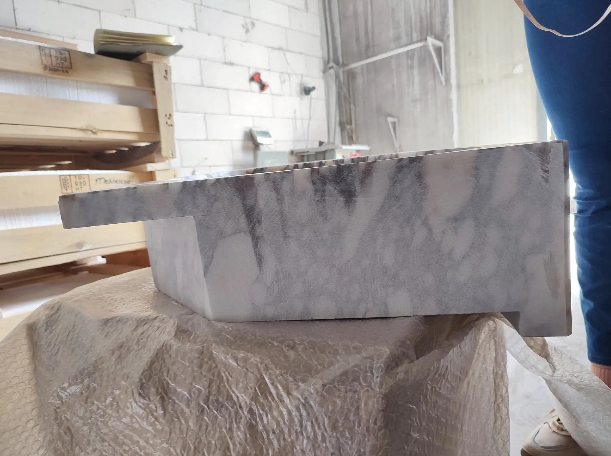 Calacatta Viola marble wall-mount corner vanity sink with ribbed surface