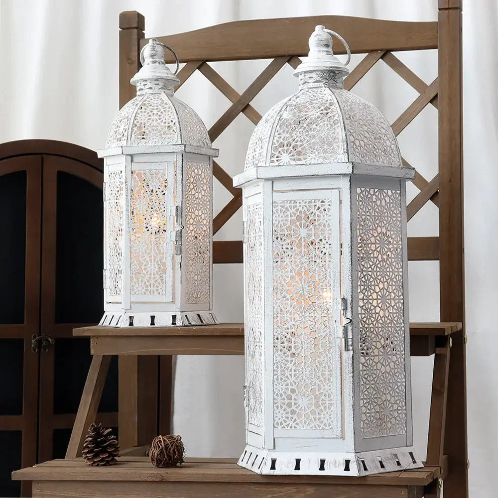 Set of 2 white metal lanterns, 15in and 19.5in tall, with intricate vintage lattice details by JHY DESIGN.