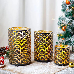 Metal hurricane lanterns, set of 3, with intricate fan-pattern perforations and gold interior glow