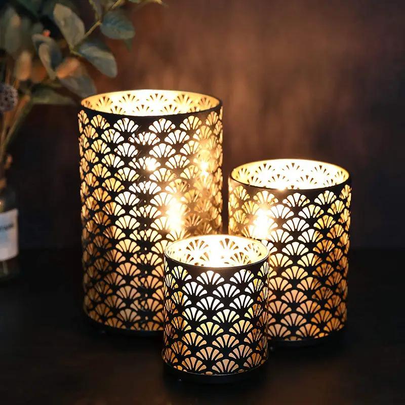 Metal hurricane holder set of 3 decorative candle lanterns, black with gold perforated fan pattern.