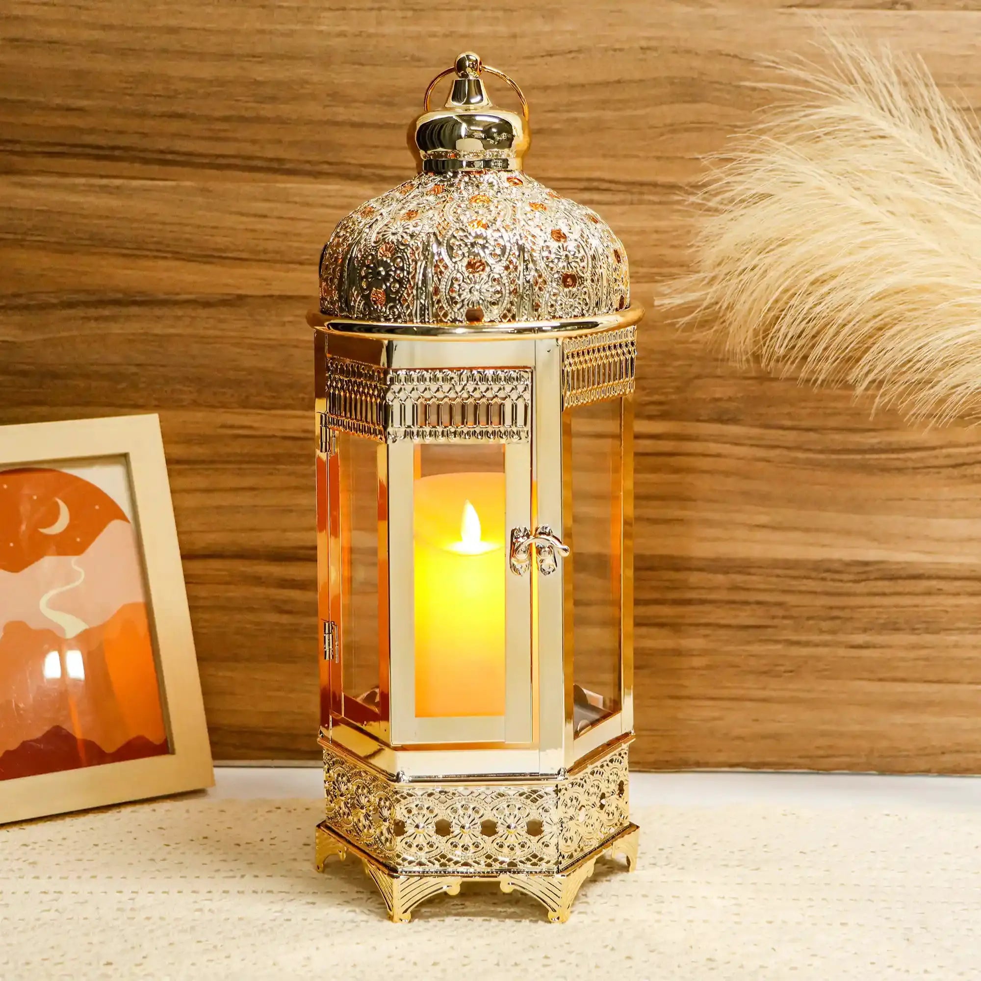 Moroccan candle lantern, 16-inch gold hexagonal metal holder with ornate filigree and lit candle