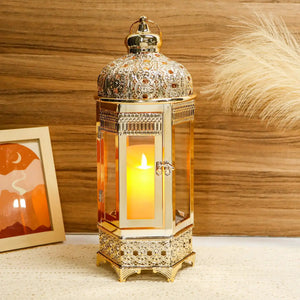 Moroccan candle lantern, 16-inch gold hexagonal metal holder with ornate filigree and lit candle