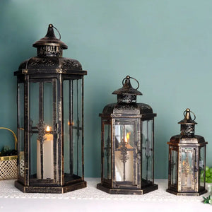 Set of 3 decorative candle lanterns, black with gold brush finish, heights 20.5, 14 and 10 inches