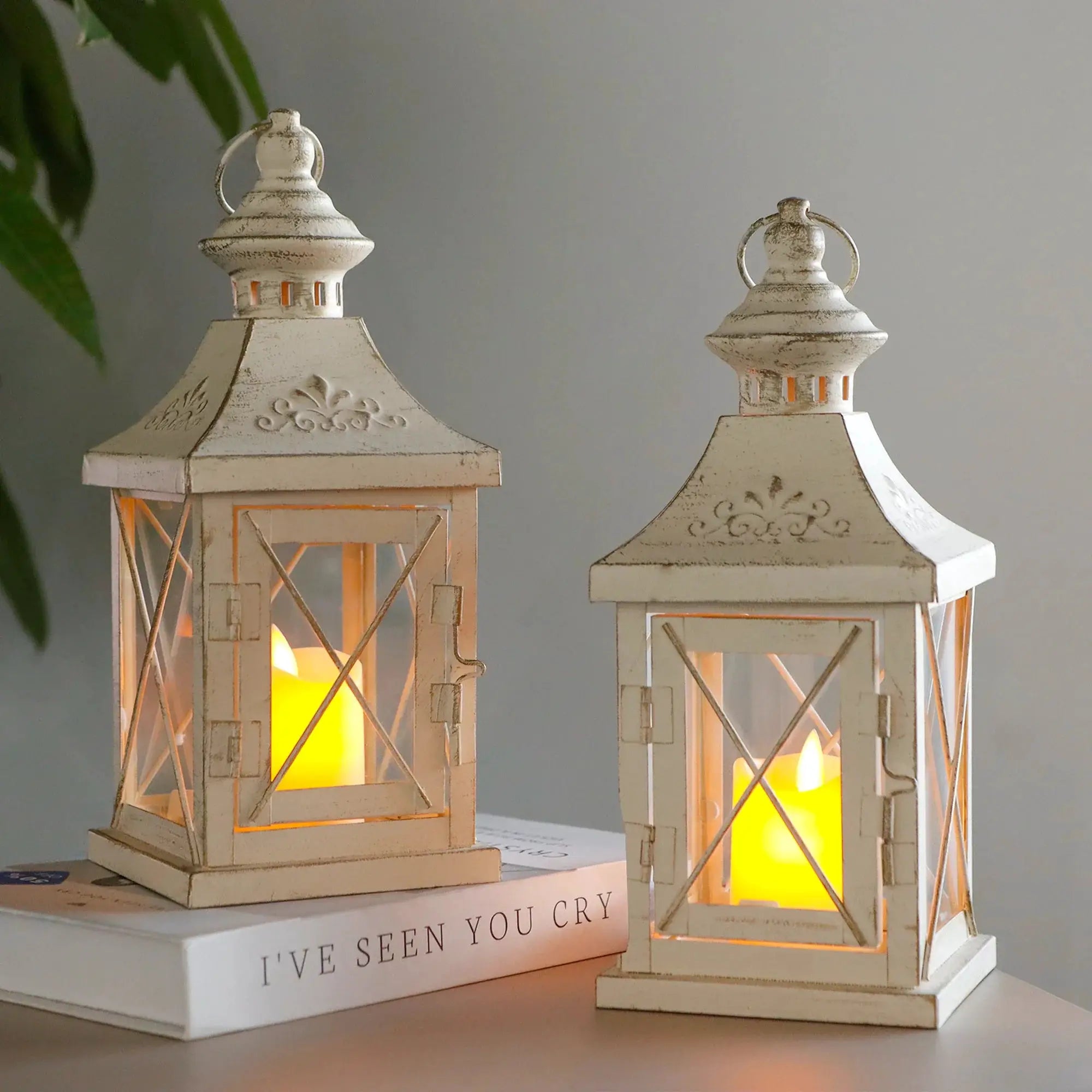 Set of 2 11in high distressed white decorative candle lanterns with warm glow