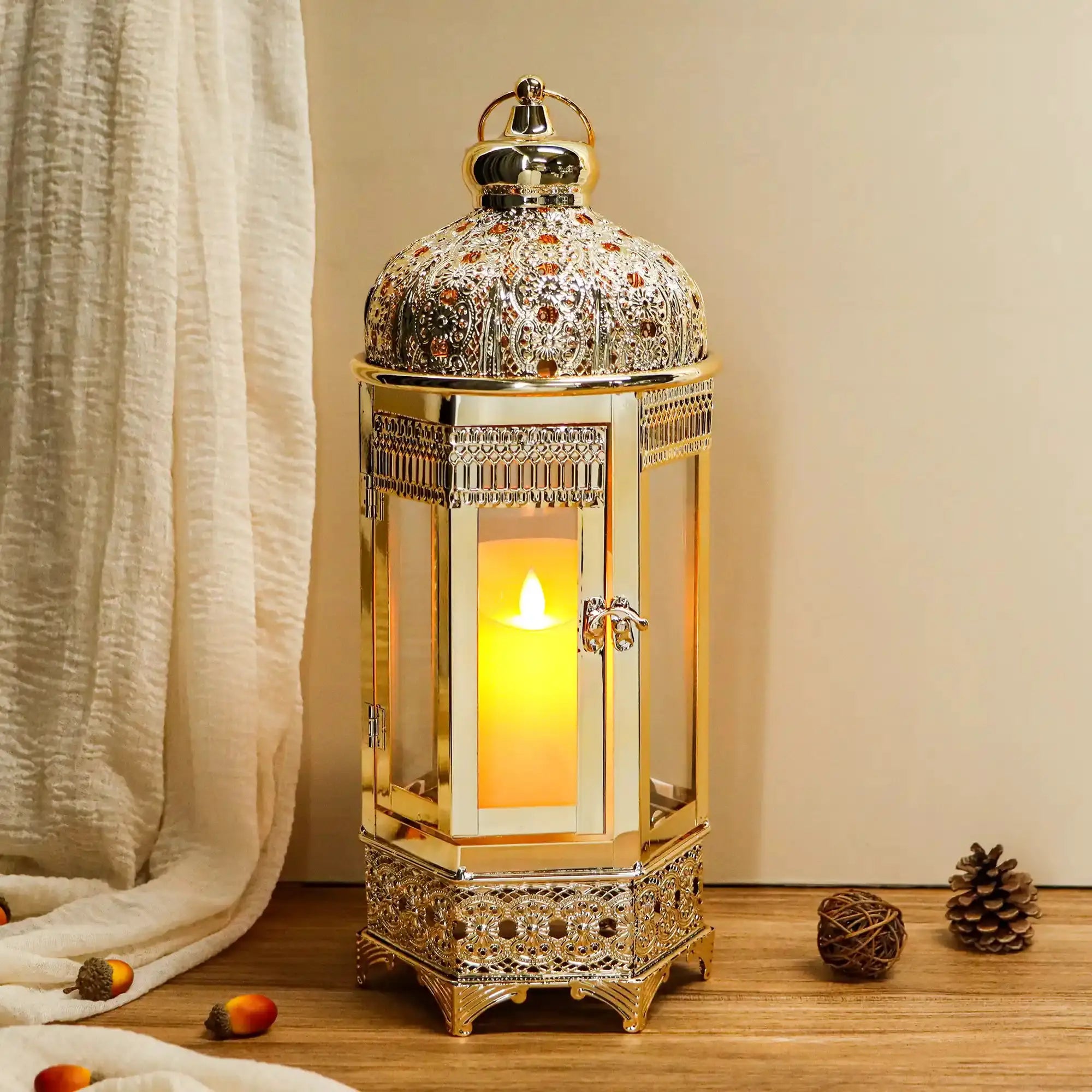 Moroccan candle lantern by JHY DESIGN, gold hexagonal metal holder with lit candle
