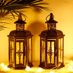 10inch High Decorative Candle Lanterns, pair of black metal lanterns with glass panels and ornate tops, warm candlelight