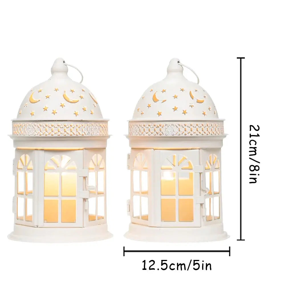 White decorative lanterns set of 2, 8.5 inches tall with moon and star cutouts and warm interior light