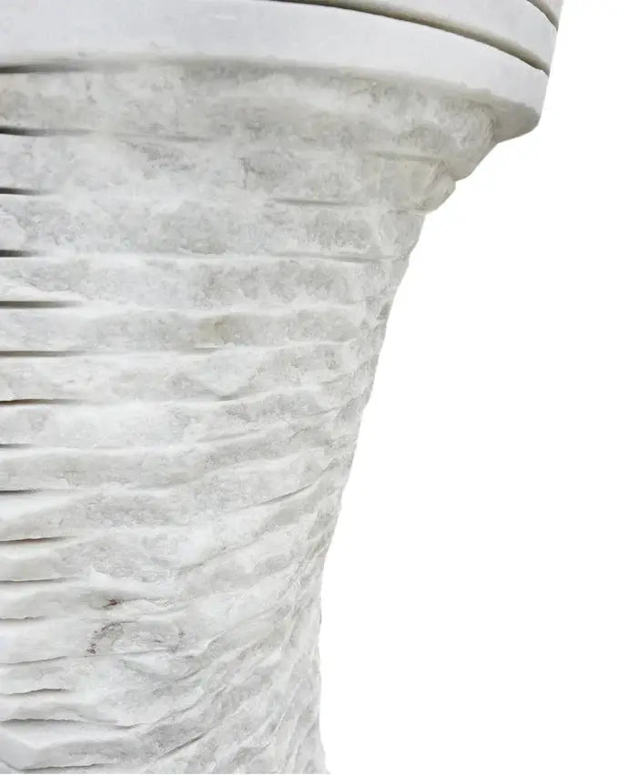 Carrara white marble pedestal sink with a textured ribbed pedestal.
