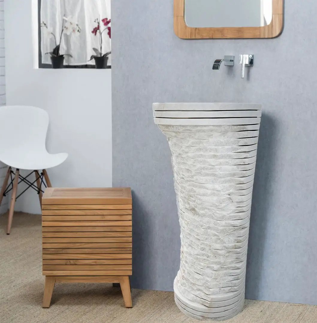 Carrara white marble pedestal sink with a tall ribbed stone base
