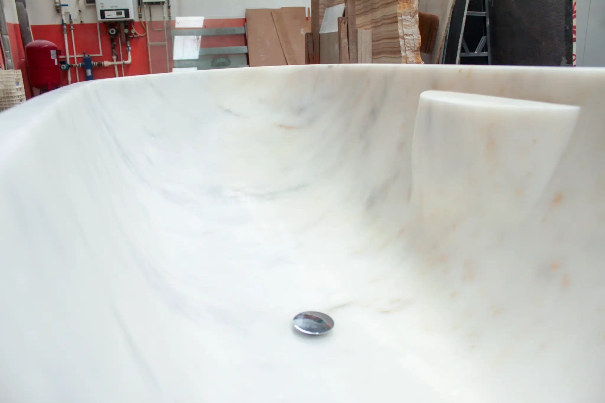 Bianco Carrara marble bathtub by Villohome, hand-carved from solid white marble with grey veining