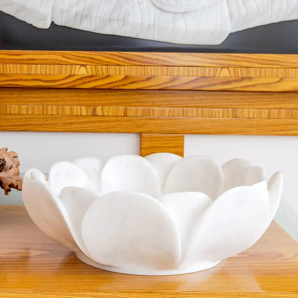 Carrara white marble flower-shaped bathroom sink bowl on wood vanity countertop