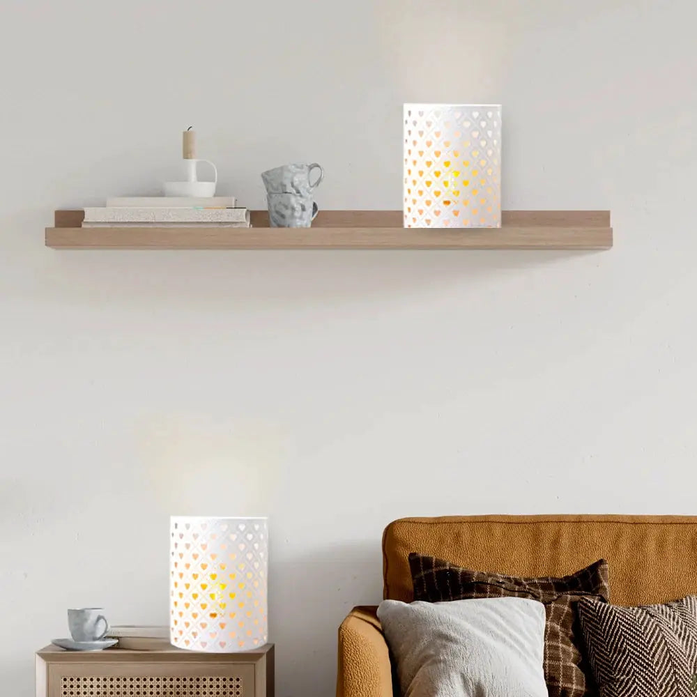 Set of 2 white heart-shaped lattice wall sconces, 8 inches tall, battery-operated.