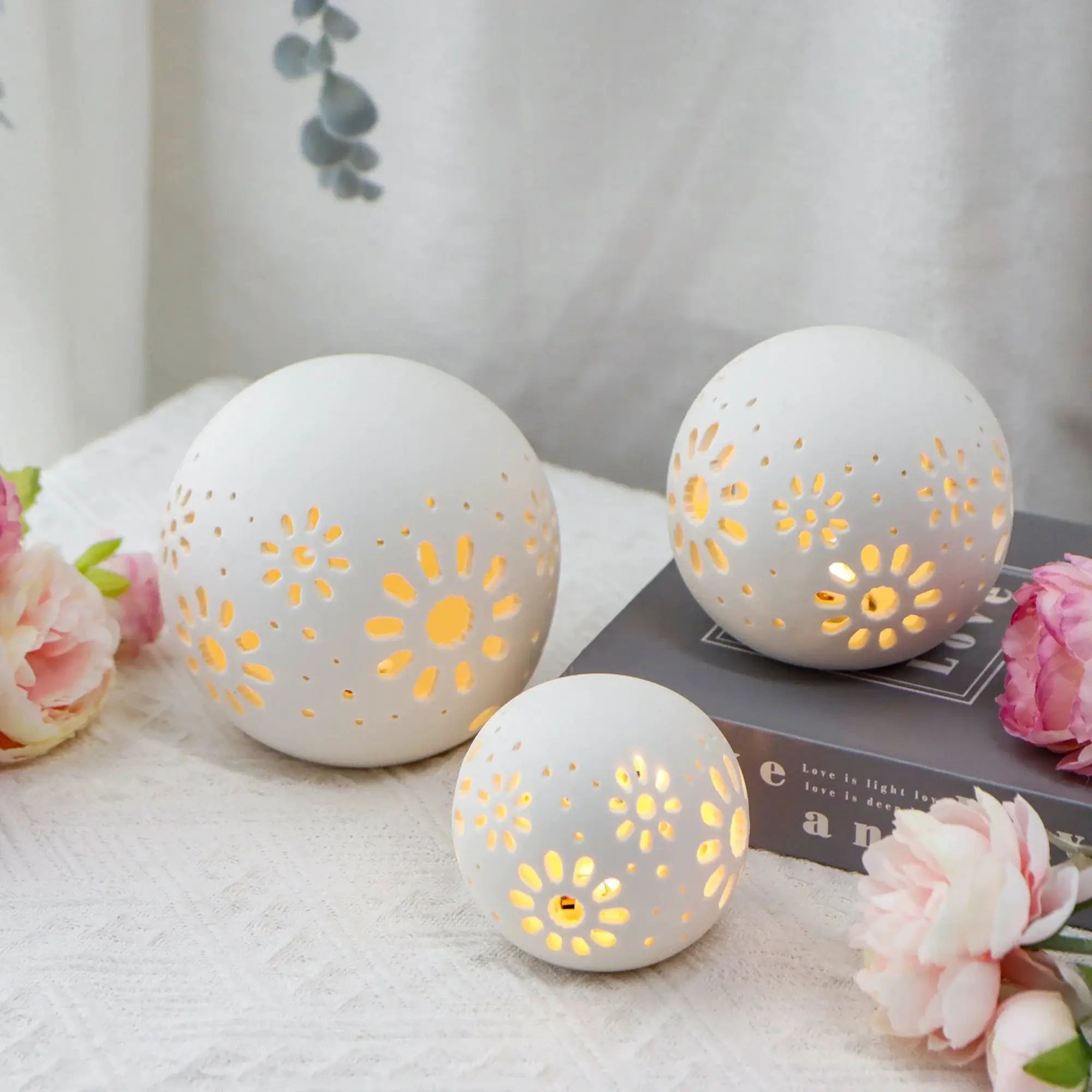 Set of 3 white ceramic decorative lamps, 5-inch tall, with carved floral perforations; battery-operated.