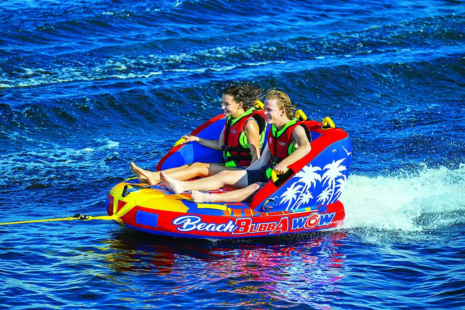 Beach Bubba 2P towable raft by WOW Watersports, red and blue with palm tree graphics, for two riders