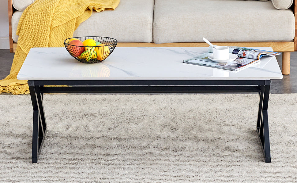 A coffee table made of rock slab material, with a smooth and natural surface that complements the modern design of the black metal legs, making it suitable for living rooms of all sizes.47*23.6