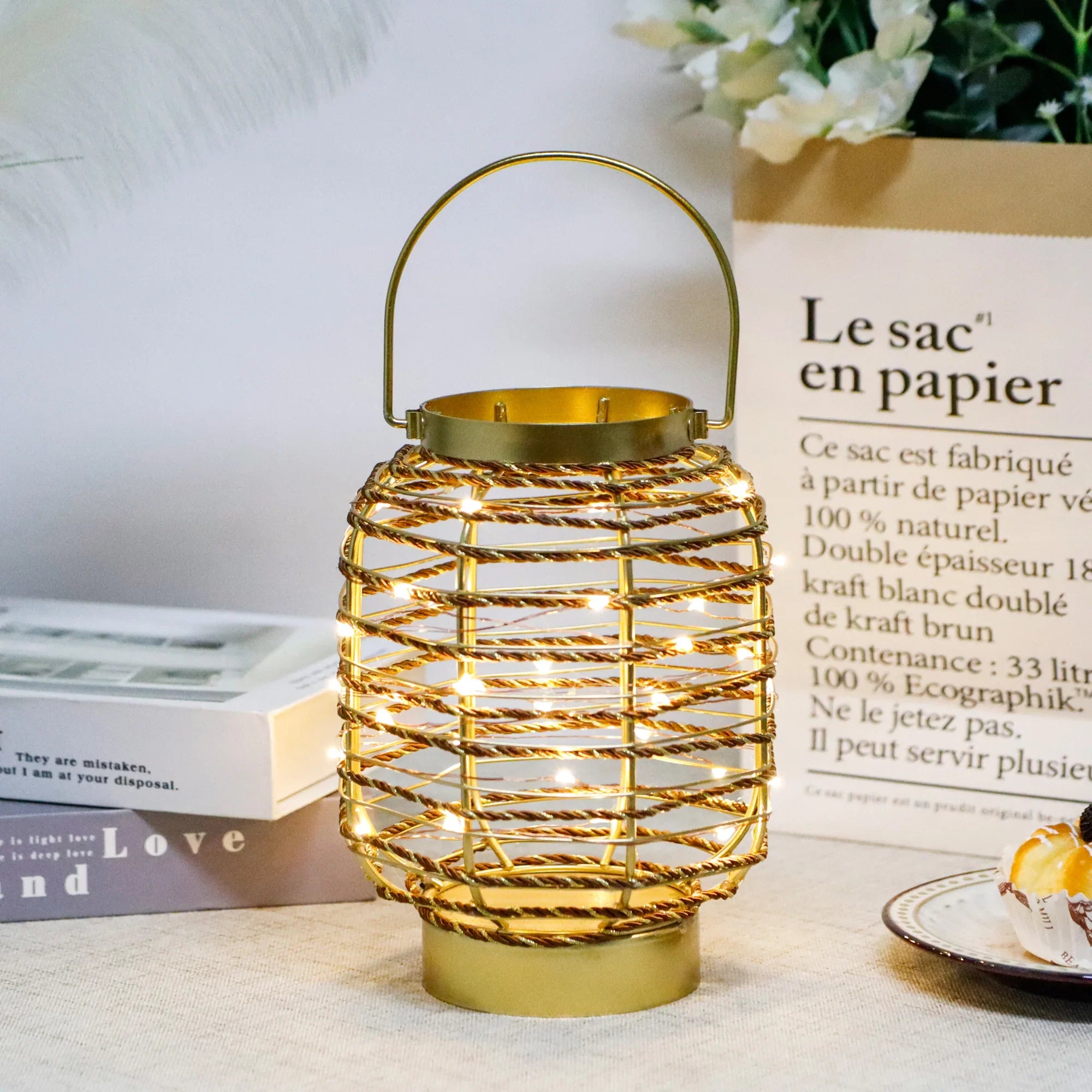 7.7 in H metal cage LED cordless table lamp by JHY DESIGN; gold finish with warm string lights