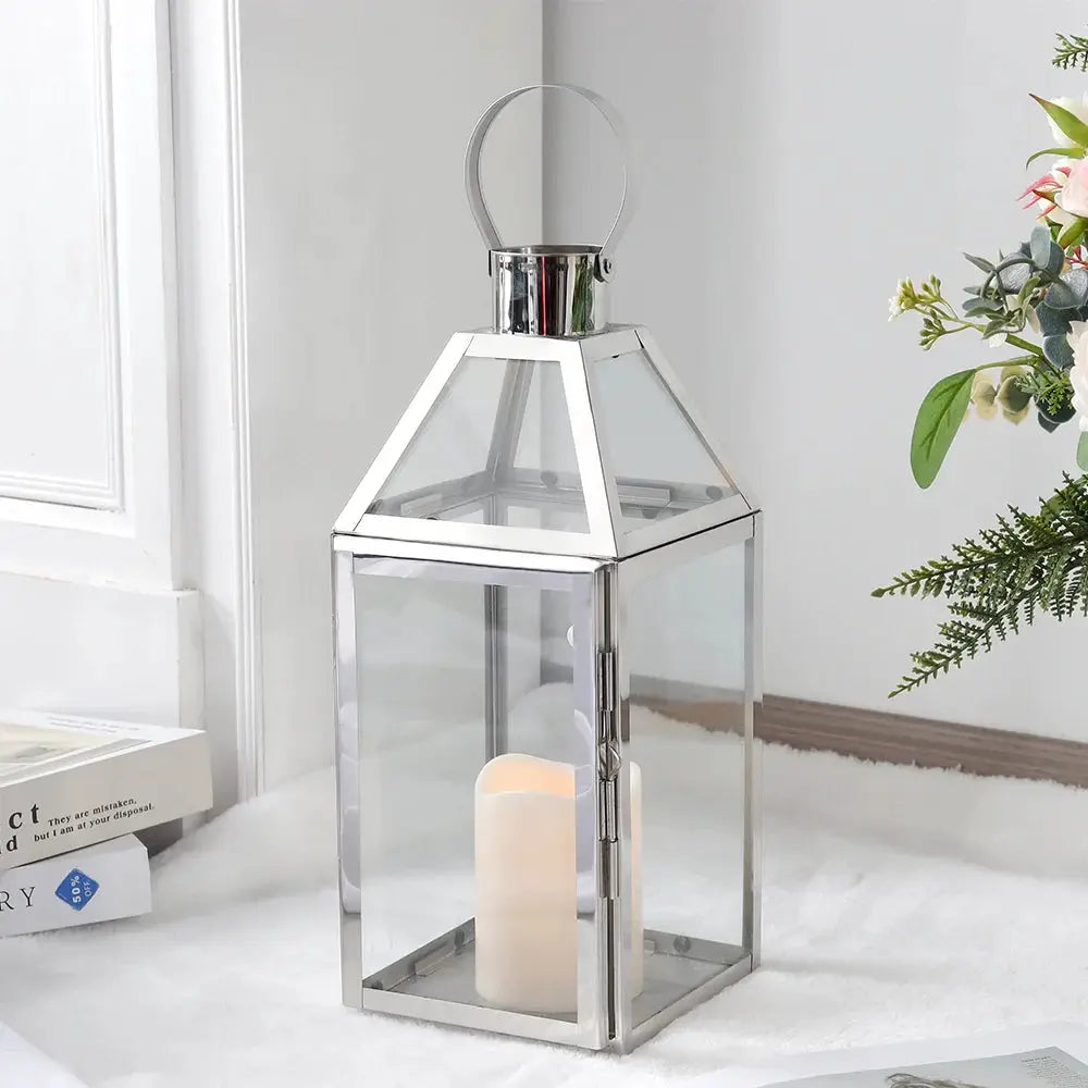 16-inch rose gold decorative candle lantern with glass panels and metal frame.