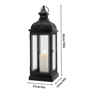 19-inch high rustic black metal candle lantern with glass panels.