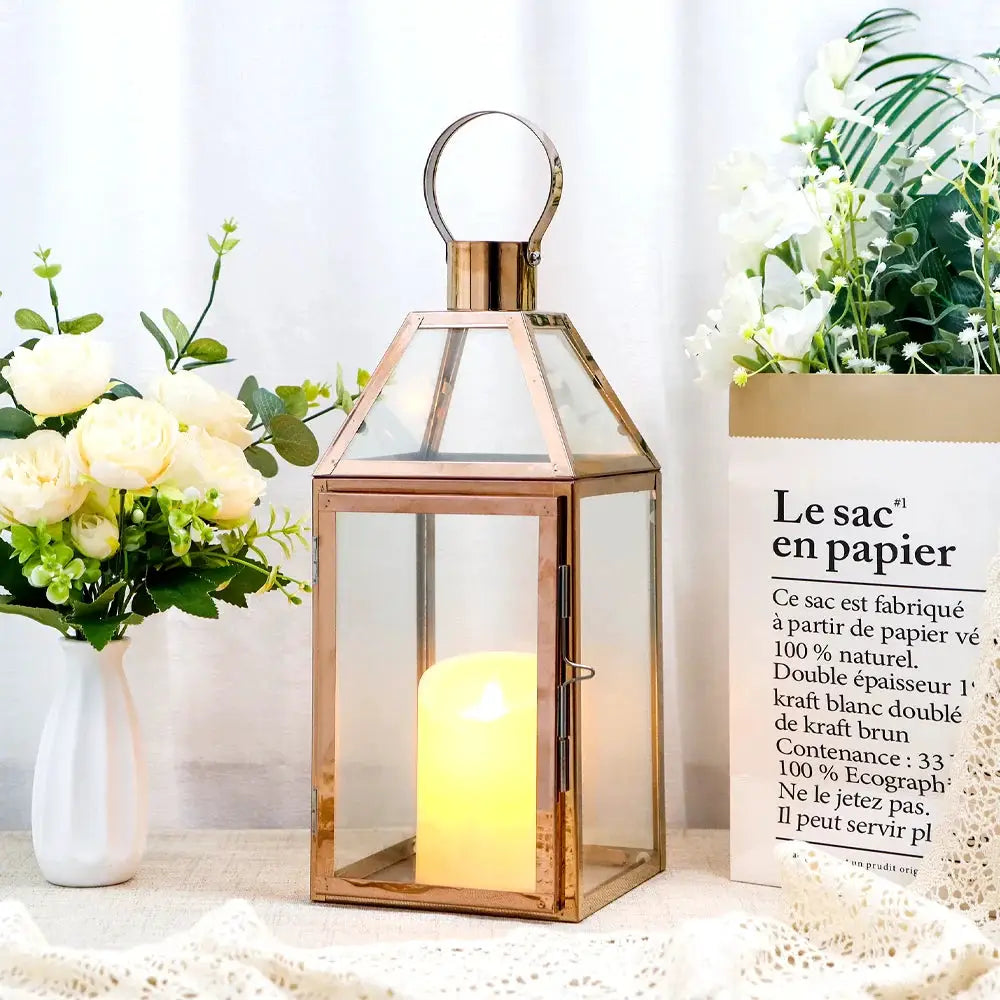 16 inch High Decorative Lantern, rose-gold metal frame with glass panels and candle inside