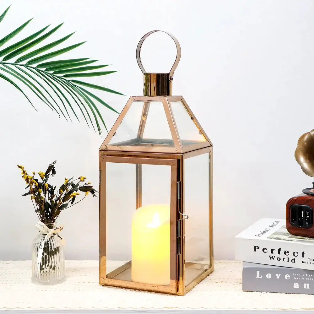 16-inch rose-gold decorative candle lantern by JHY DESIGN with glass panels and a lit candle