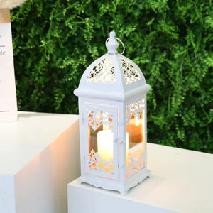 15-inch white decorative candle lantern with ornate floral lattice panels and a lit candle