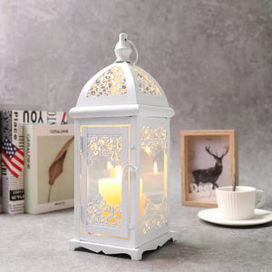 JHY DESIGN 15-inch tall decorative candle lantern, white metal with ornate cutwork panels, lit from inside.