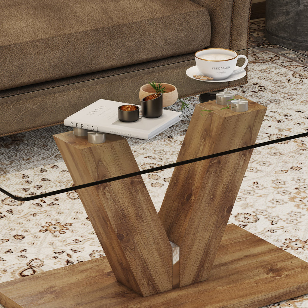A modern minimalist style coffee table. Transparent tempered glass tabletop with wooden MDF columns. Suitable for living room and dining room.  CT-V