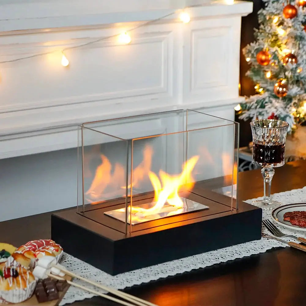 Rectangular tabletop fire bowl with four-sided glass panels on a black base, gel/ethanol fireplace