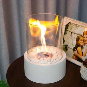 Extra large portable tabletop fire bowl with glass cylinder, white stones and bright flame