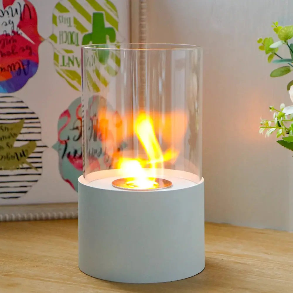 11.5-inch Tabletop Fire Bowl Fireplace by JHY DESIGN; white base, clear glass cylinder, gel/ethanol flame.