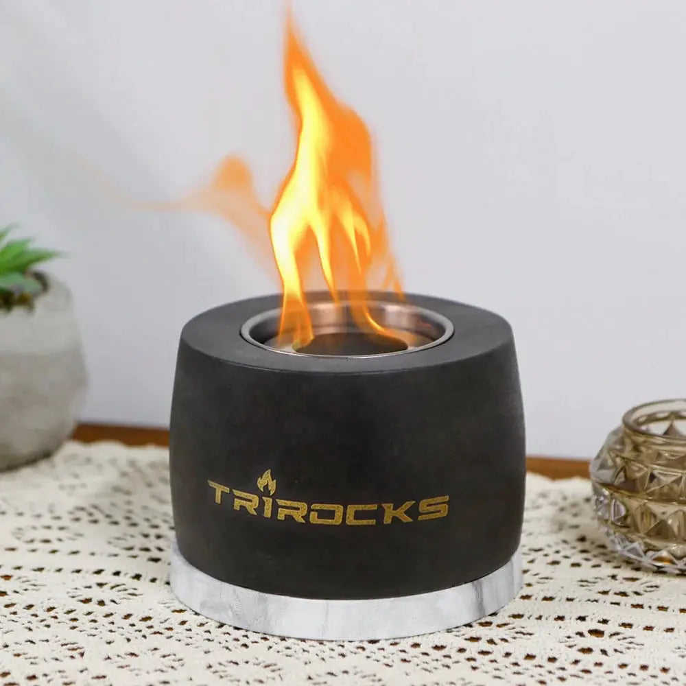 Portable concrete fireplace in black graphite cement with gold TRIROCKS logo