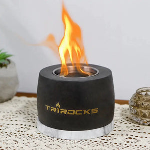 Portable concrete fireplace in black graphite cement with gold TRIROCKS logo